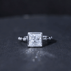 Bezel Set Moissanite Princess Cut Engagement Ring with Spaced Accent