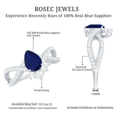 Pear Cut Blue Sapphire and Diamond Crossover Engagement Ring