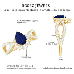 Pear Cut Blue Sapphire and Diamond Crossover Engagement Ring