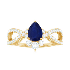 Pear Cut Blue Sapphire and Diamond Crossover Engagement Ring