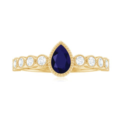 Pear Cut Blue Sapphire Solitaire Ring with Diamond Accent