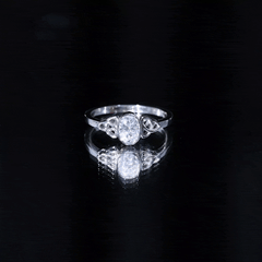Oval Moissanite Solitaire Celtic Knot Ring in Bezel Setting