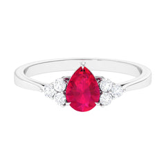 Claw Set Ruby Pear Solitaire Ring with Diamond Trio
