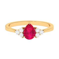Claw Set Ruby Pear Solitaire Ring with Diamond Trio