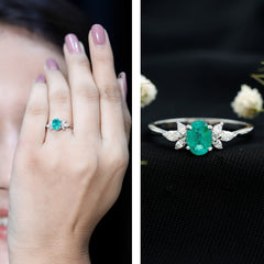 Oval Shaped Emerald Engagement Ring with Marquise Diamond Trio