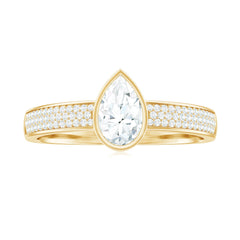 Pear Cut Moissanite Bezel Set Engagement Ring With Side Stones