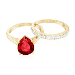 Pear Shape Created Ruby Solitaire Wedding Ring Set with Moissanite