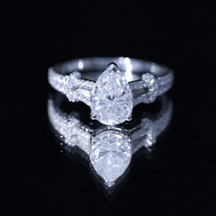 Pear Shaped Moissanite Solitaire Engagement Ring in Split Shank