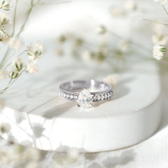 Pear Shaped Moissanite Solitaire Engagement Ring with Beaded Design