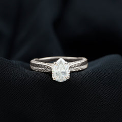 Claw Set Pear Shape Moissanite Engagement Ring