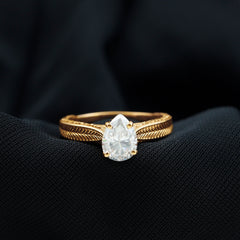 Claw Set Pear Shape Moissanite Engagement Ring