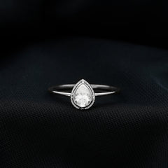 Pear Shaped Moissanite Solitaire Engagement Ring in Bezel Setting