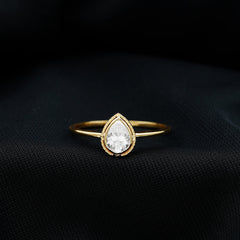 Pear Shaped Moissanite Solitaire Engagement Ring in Bezel Setting