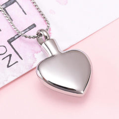 Silver Heart Shaped Cremation Urn Necklace With Angel Wings Engraved "Mother Of An Angel"