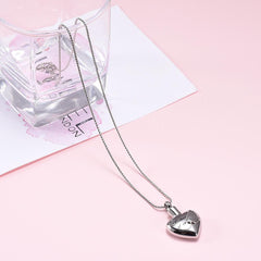 Silver Heart Shaped Cremation Urn Necklace With Angel Wings Engraved "Mother Of An Angel"