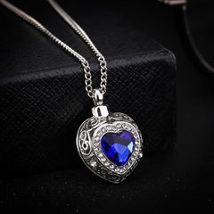 Silver Heart Shaped Cremation Urn Necklace with Rhinestones and Blue Gem